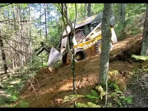 Making Trail on Steep Hill With Skid Steer 